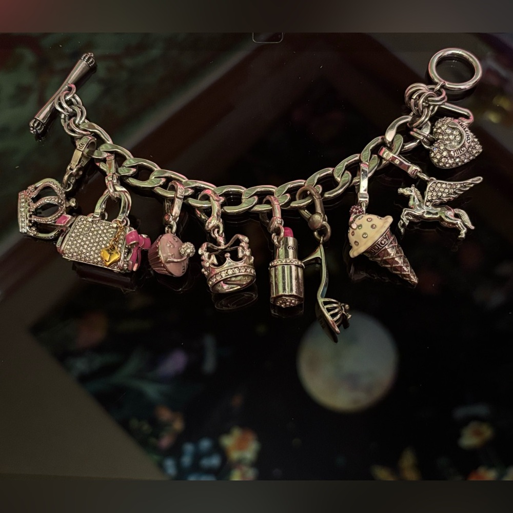 Silver juicy couture charm bracelet with 9 charms